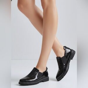 Brown's Couture Lilybelle loafer in a black crocodile-embossed patent finish